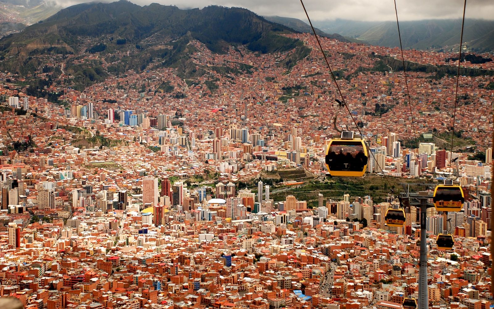 four running cable cars during daytime